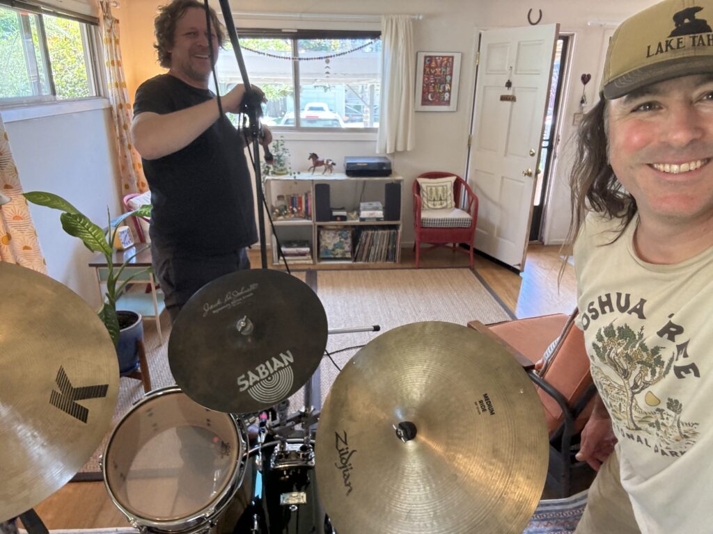 Photo of a man setting a microphone.