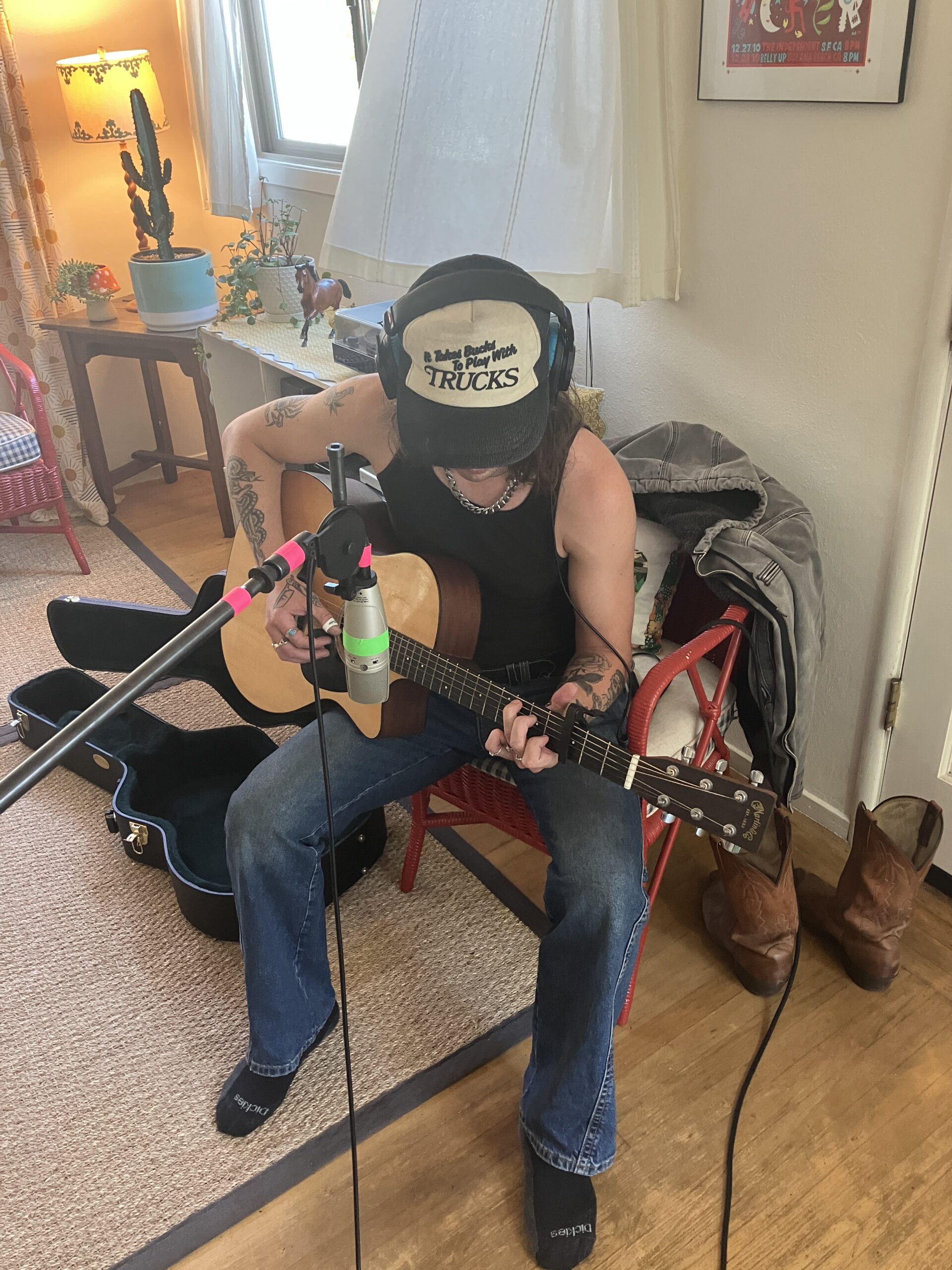 A guitarist warming up before a recording session.