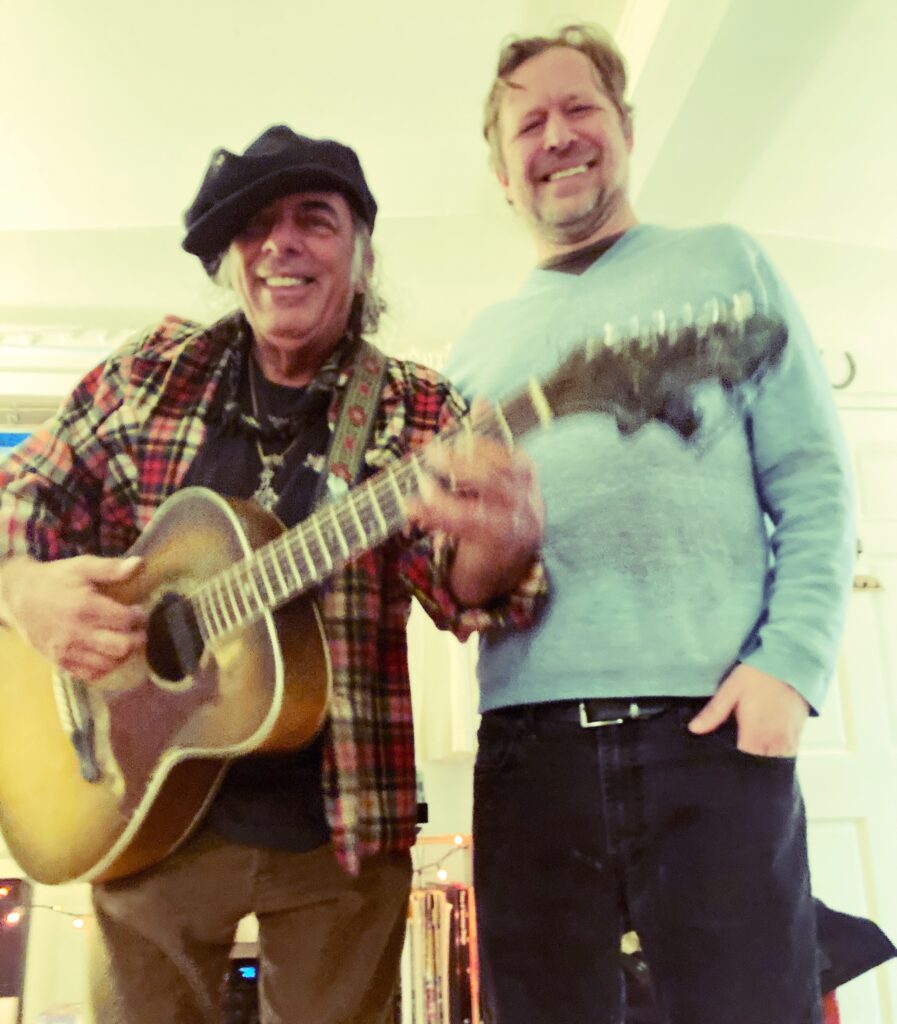 Photo of a musician and the studio owner.