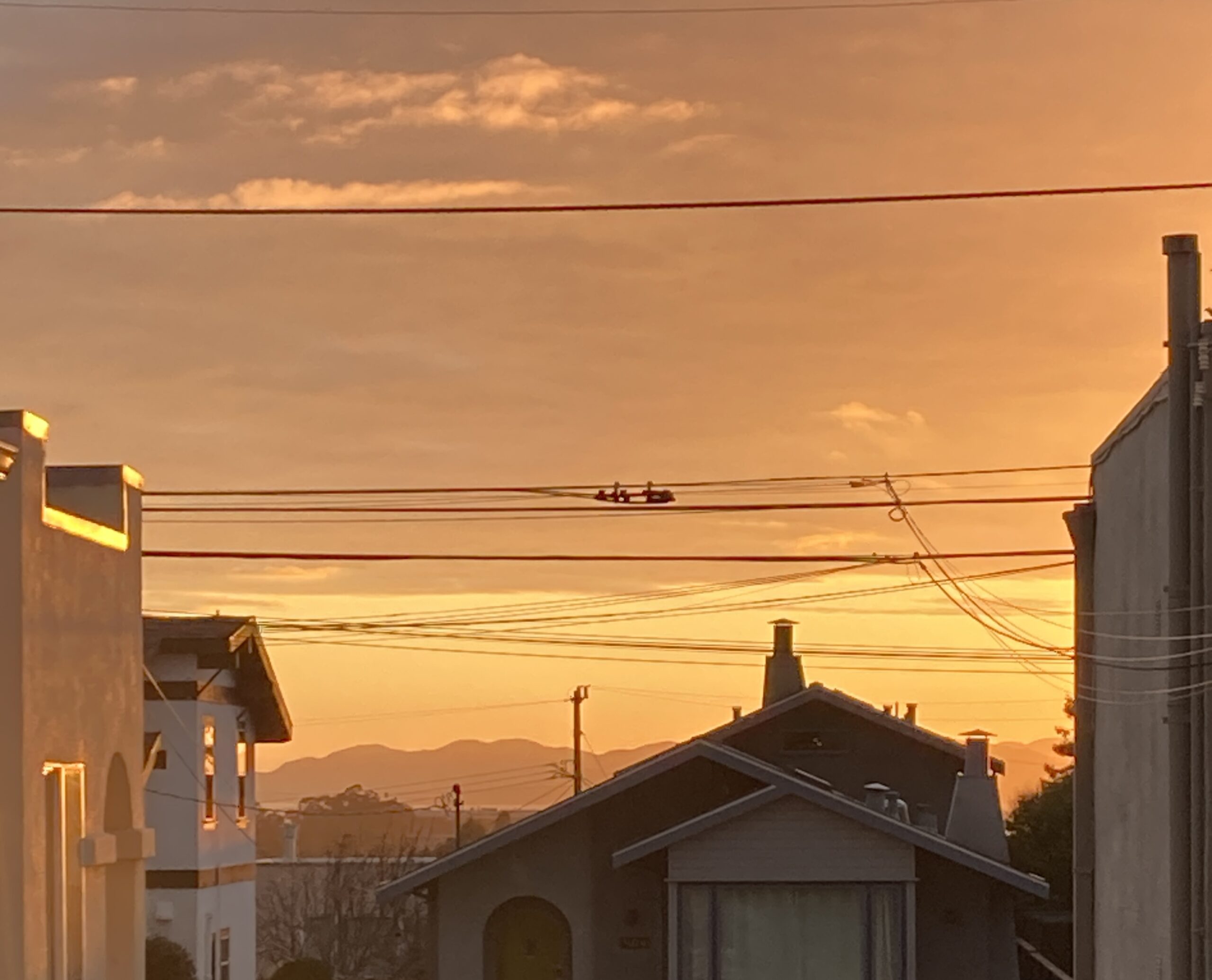 A photo of houses and golden sunlight.