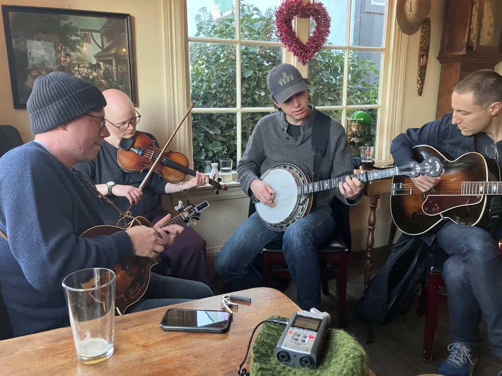 Photo of a bluegrass musician group at a pub.