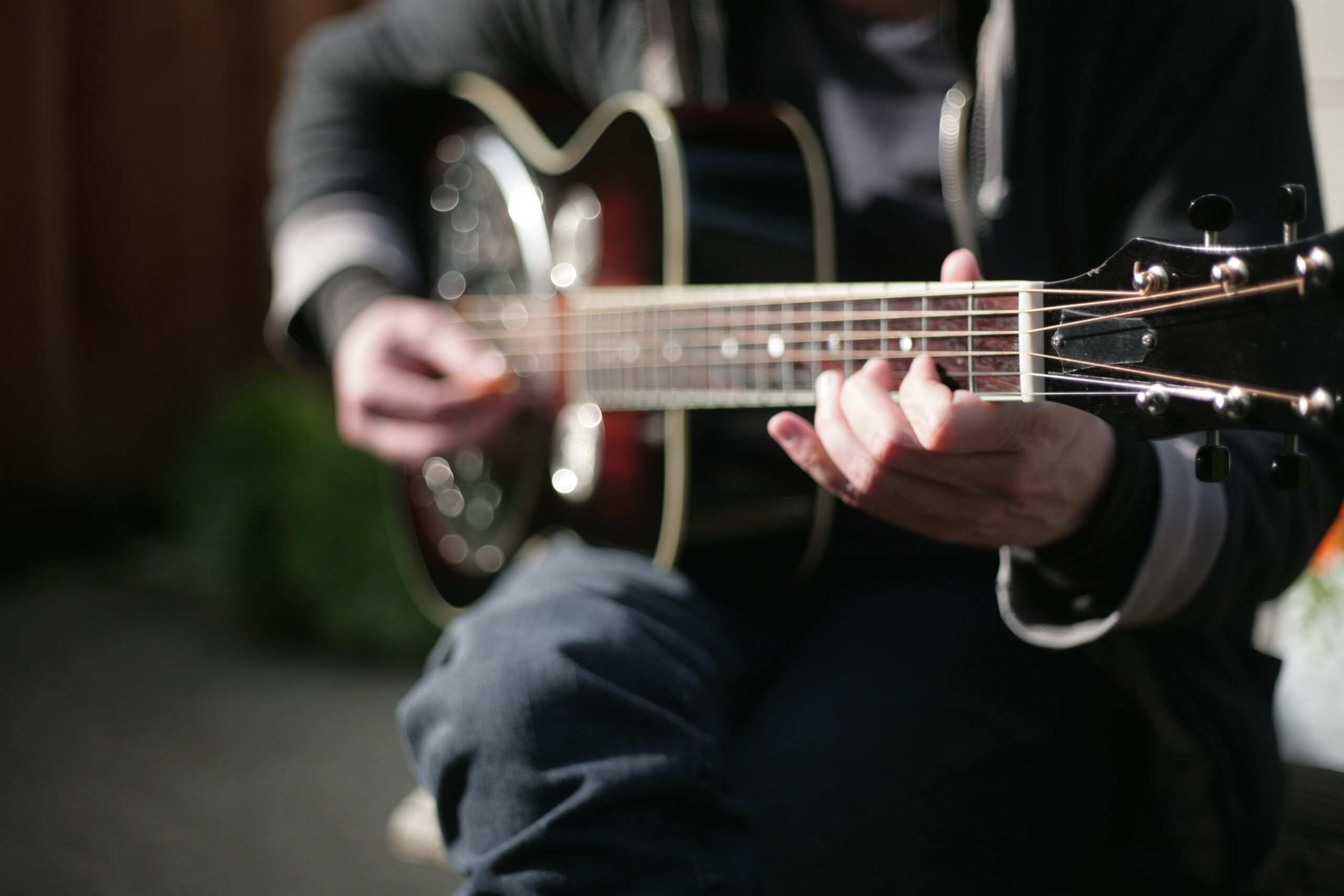 A musician holding a dobro.