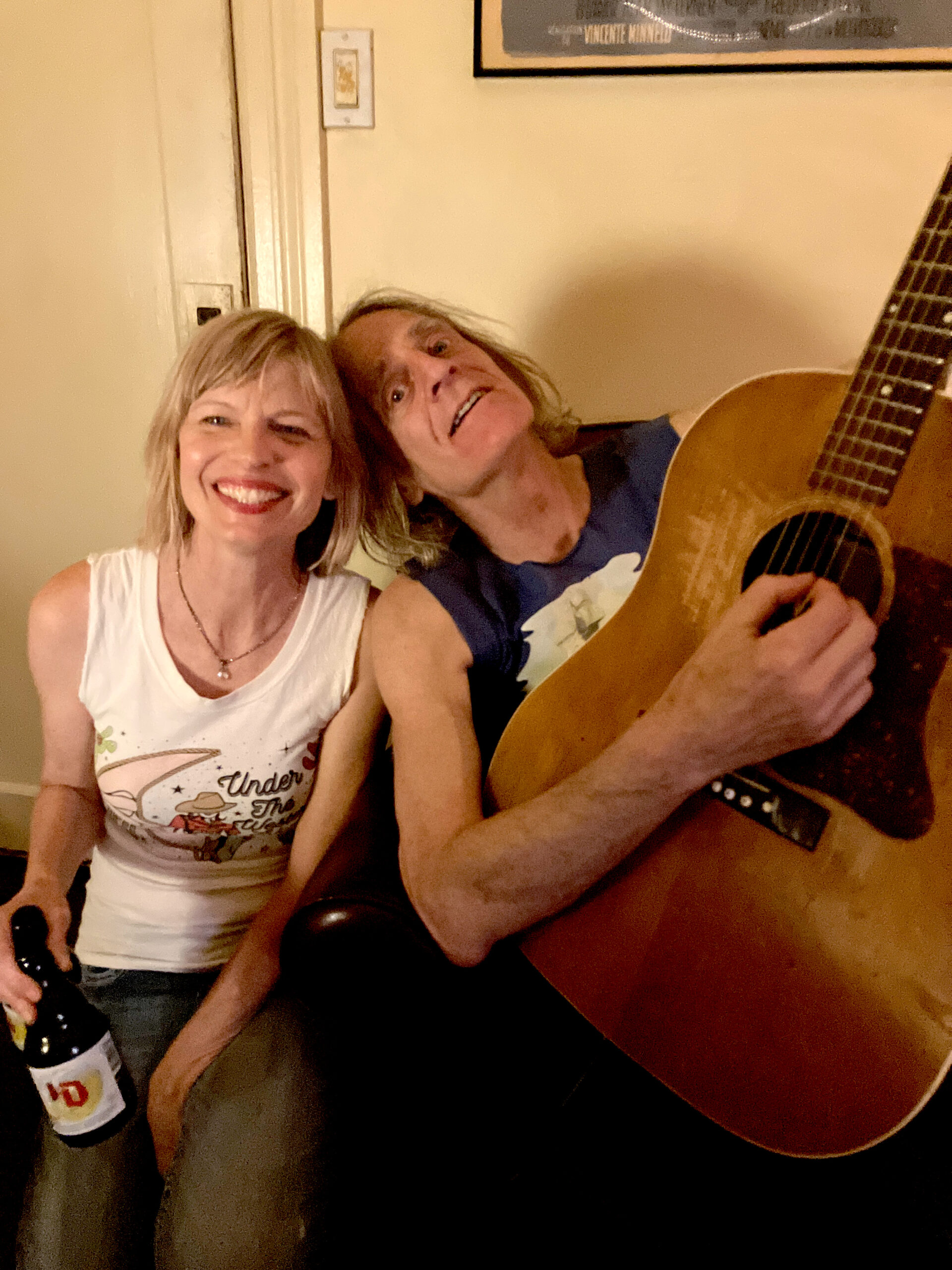 A photo of a musician and a woman.