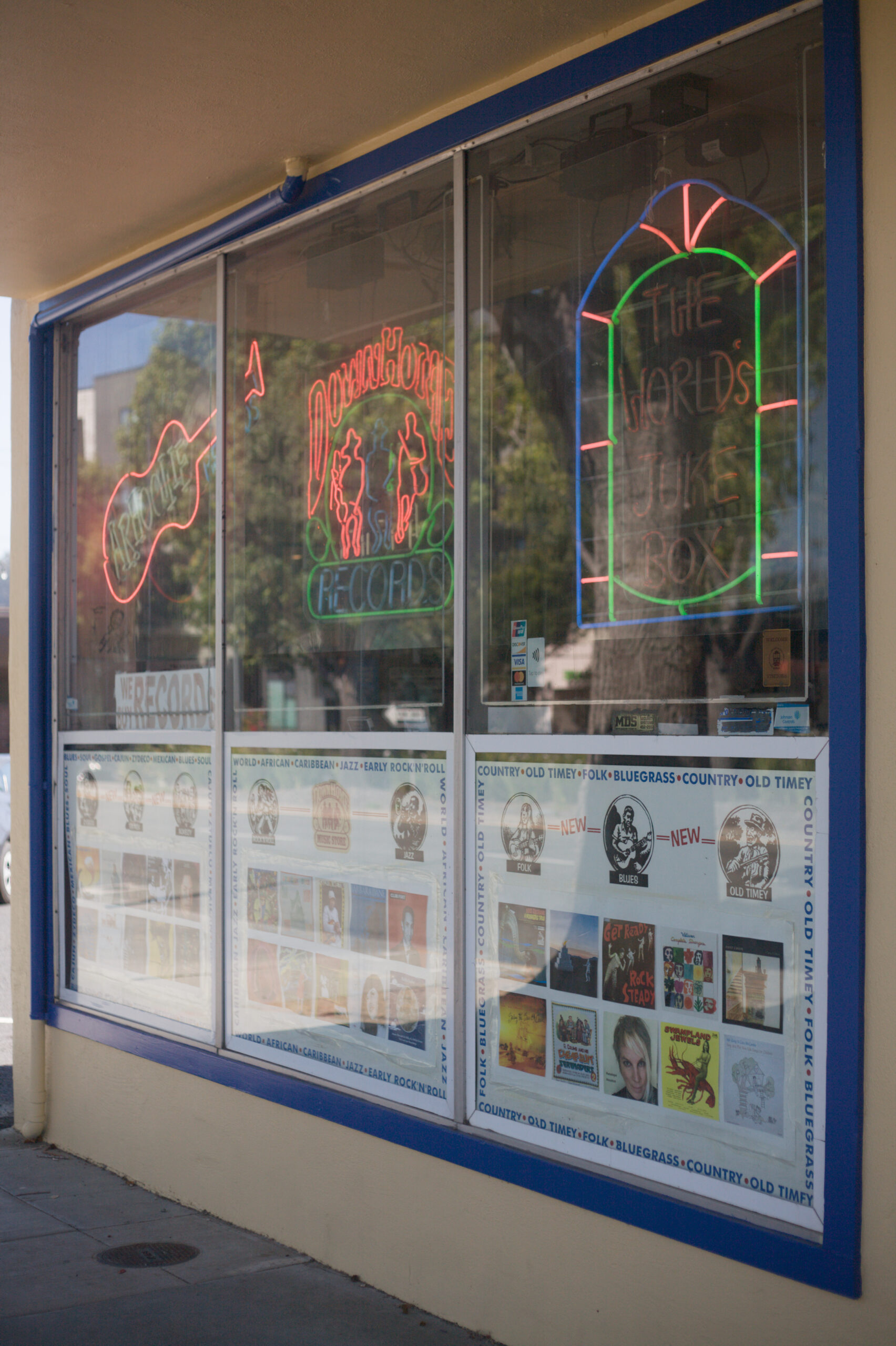 Photo of a record shop store front. /><figcaption class=